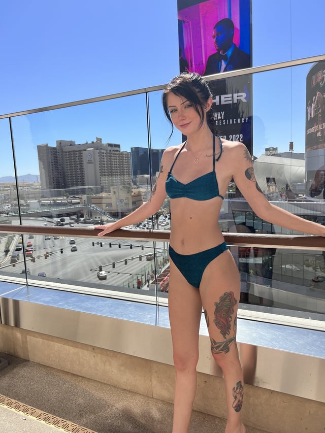 Tattooed little slut on the rooftop pool deck